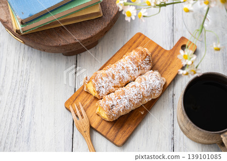 Cornet on a wooden plate 139101085
