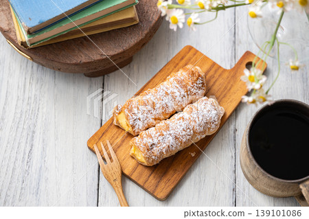 Cornet on a wooden plate 139101086