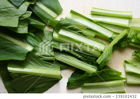 Komatsuna cut on a cutting board Komatsuna cut on a cutting board 139101432