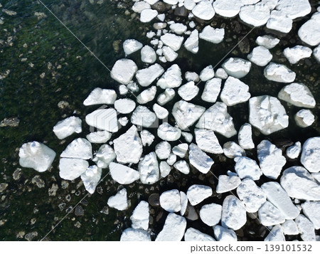 Aerial photograph of drift ice remaining on the coastline of Utoro, Hokkaido. Aerial photograph of drift ice remaining on the coastline of Utoro, Hokkaido. 139101532