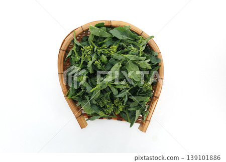 Fresh mustard greens served in a basket Fresh mustard greens served in a basket 139101886