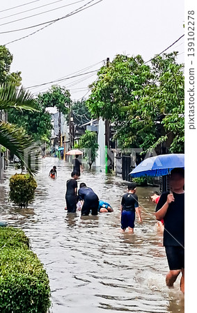 Pamulang, Jakarta, April 4, 2026: View of the flood disaster in the residential area Pamulang, Jakarta, April 4, 2026: View of the flood disaster in the residential area 139102278