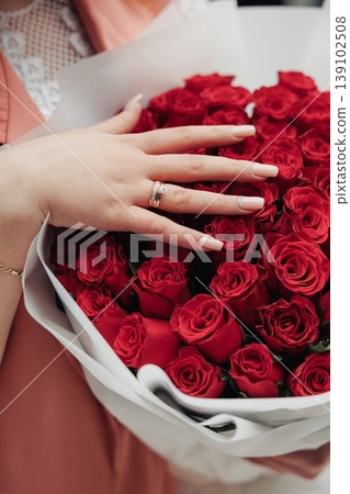 Graceful Hand View. Elegant Fingers Gently Placed On Blooming Floral Display With Wedding Band. Sophisticated Hand Resting Softly On Colorful Blossoms Prominently Displaying Bridal Ring Graceful Hand View. Elegant Fingers Gently Placed On Blooming Floral Display With Wedding Band. Sophisticated Hand Resting Softly On Colorful Blossoms Prominently Displaying Bridal Ring 139102508