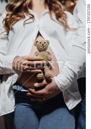 Pregnant Woman Cradling Teddy On Belly, White Expectant Mother Placing Plush Toy Against Bump In Sentimental Nursery Preparation Scene Gentle Hands And Soft Textures Emphasize Warmth, Memory Pregnant Woman Cradling Teddy On Belly, White Expectant Mother Placing Plush Toy Against Bump In Sentimental Nursery Preparation Scene Gentle Hands And Soft Textures Emphasize Warmth, Memory 139102588