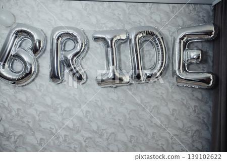 Silver BRIDE Balloon Letters Against Lace Backdrop, Metallic Sheen Catching Soft Light, Subtle Shadows, Intimate Bridal Shower Decor With Minimalist Wedding Styling, Monochrome Palette 139102622