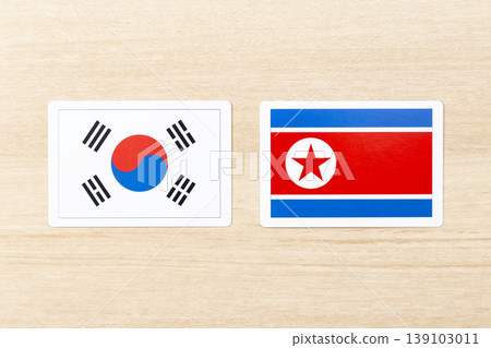 The flags of South Korea and North Korea are placed on the table. 139103011
