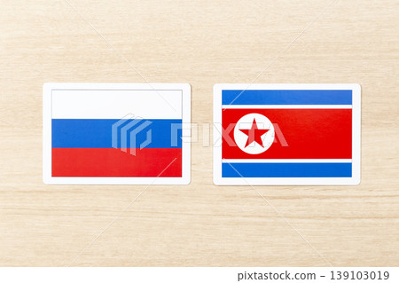 Russian and North Korean flags placed on the table Russian and North Korean flags placed on the table 139103019