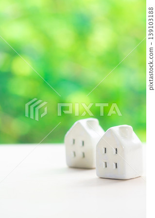 Miniature house with a natural green background Miniature house with a natural green background 139103188