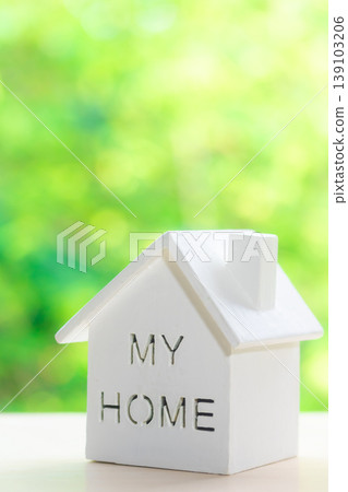 Miniature house with a natural green background Miniature house with a natural green background 139103206