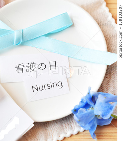 May 12th is Nurses' Day, commemorating Florence Nightingale's birthday. Blue ribbons and flowers are displayed. May 12th is Nurses' Day, commemorating Florence Nightingale's birthday. Blue ribbons and flowers are displayed. 139103207