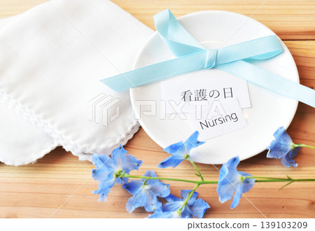 May 12th is Nurses' Day, commemorating Florence Nightingale's birthday. Blue ribbons and flowers are displayed. May 12th is Nurses' Day, commemorating Florence Nightingale's birthday. Blue ribbons and flowers are displayed. 139103209