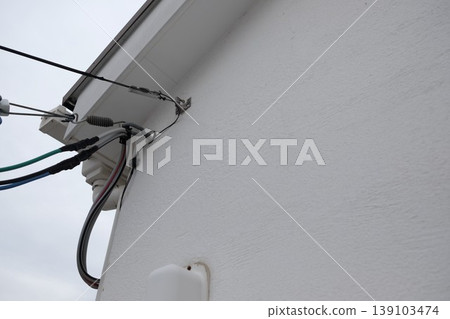 Antenna installed on the plaster exterior wall Antenna installed on the plaster exterior wall 139103474