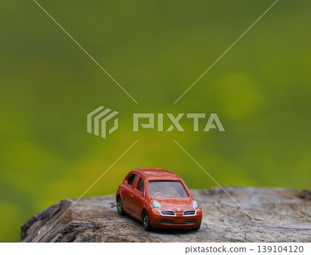 Landscape with minicars, march with green background Landscape with minicars, march with green background 139104120