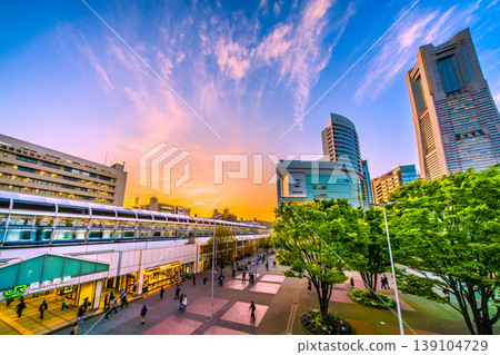 A new view of Yokohama, Japan, on April 21st. A view of Sakuragicho Station, Yokohama Landmark Tower, and trains illuminated by the sunset. A new view of Yokohama, Japan, on April 21st. A view of Sakuragicho Station, Yokohama Landmark Tower, and trains illuminated by the sunset. 139104729