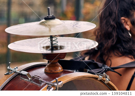 Detail of a musical instrument, bass drum and cymbals belonging to a chinchinera, a female street musician who dances and plays her drum in the streets. Chilean heritage, Chilean culture, national 139104811