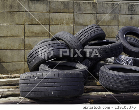 A scene of used tires collected as industrial waste. A scene of used tires collected as industrial waste. 139105370