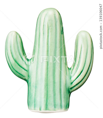 A green ceramic cactus figurine cut out against a white background. A green ceramic cactus figurine cut out against a white background. 139106047