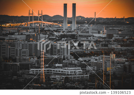 A distant view of Kawasaki with the bay bridge and the sunset. A distant view of Kawasaki with the bay bridge and the sunset. 139106523