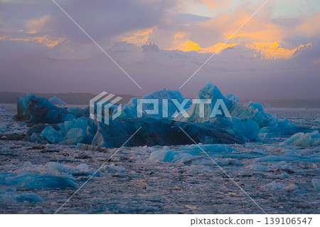 Icebergs and snow-capped mountains at sunset Icebergs and snow-capped mountains at sunset 139106547