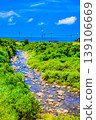 A landscape of a stream leading to the sea. 139106669