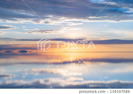 Serene sunset reflection on salt flat in Uyuni Bolivia 139107086