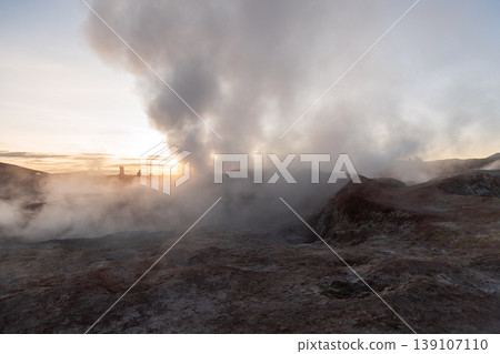 Dramatic sunrise at Sol de Manana geyser field with geothermal steam Dramatic sunrise at Sol de Manana geyser field with geothermal steam 139107110