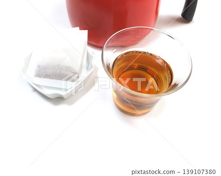 Barley tea brewed in a pot, served cold. 139107380