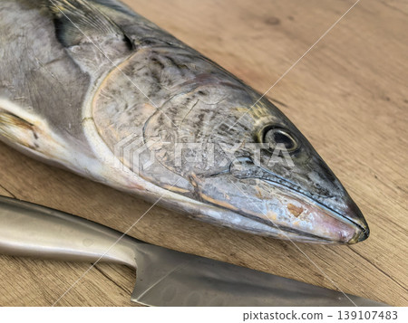 Extreme Close-up of Raw Fish Head and Kitchen Knife Extreme Close-up of Raw Fish Head and Kitchen Knife 139107483