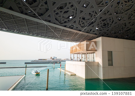 Louvre Abu Dhabi Architecture with Water Reflection Louvre Abu Dhabi Architecture with Water Reflection 139107881