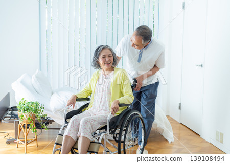 Senior couple who press wheelchair 139108494