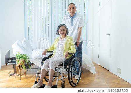 Senior couple who press wheelchair 139108495