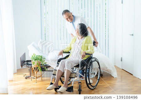 Senior couple who press wheelchair 139108496