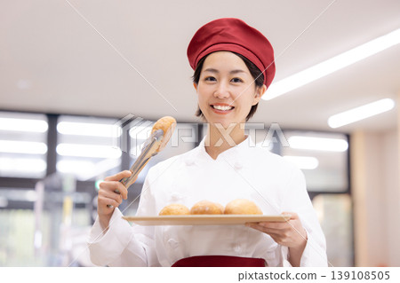 Portrait of a supermarket bakery staff member Portrait of a supermarket bakery staff member 139108505