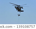 Military helicopters flying in the blue sky 139108757