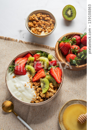 Healthy yogurt bowl with granola and fresh berries for clean eating diet Healthy yogurt bowl with granola and fresh berries for clean eating diet 139108863