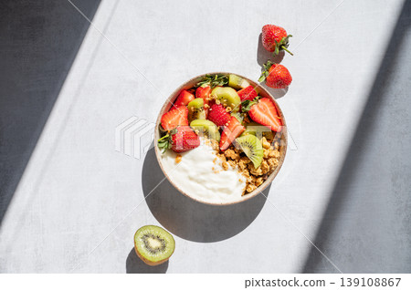 Balanced breakfast with yogurt, granola and fruits, top view 139108867