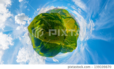 Aerial little planet view of green mountains and valleys with clouds 139109870