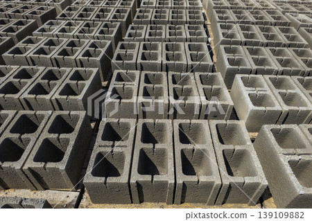 Stacks of hollow concrete blocks at construction site 139109882
