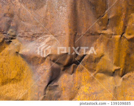 Textured crumpled thin sheet metal surface with rust and corrosion patterns Textured crumpled thin sheet metal surface with rust and corrosion patterns 139109885