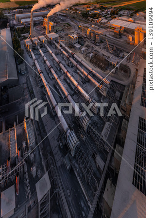 Industrial cement plant with smokestacks from above, ultra-wide angle panini projection Industrial cement plant with smokestacks from above, ultra-wide angle panini projection 139109994