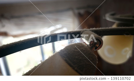 Dust builds up on the light fixture in a home during the day Dust builds up on the light fixture in a home during the day 139110702