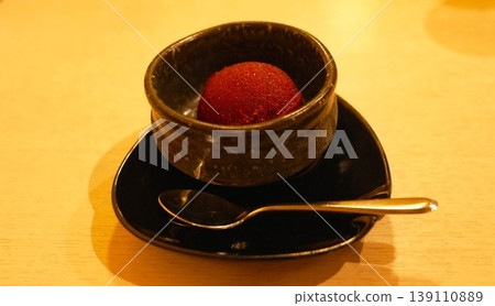 Japanese dessert: Cassis sorbet, served on black Japanese tableware. Japanese dessert: Cassis sorbet, served on black Japanese tableware. 139110889