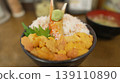 Luxurious seafood bowl overflowing with sea urchin and crab, served with crab claws and wasabi, featuring the fresh texture of sea urchin. 139110890