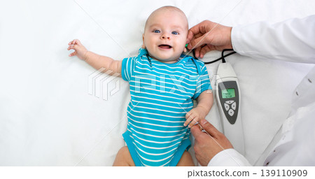Newborn hearing screening and diagnosis at the hospital. Baby having hearing screening, Otoacoustic Emissions 139110909