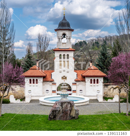 White Bell Tower and Stone Fountain at Curchi Monastery Grounds White Bell Tower and Stone Fountain at Curchi Monastery Grounds 139111163