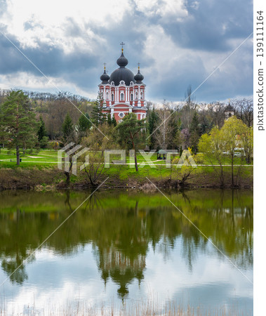 Panoramic View of Curchi Monastery Reflected in Peaceful Lake Water Panoramic View of Curchi Monastery Reflected in Peaceful Lake Water 139111164