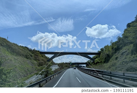 A scene of highways and bridges under a blue sky: an image of Japanese infrastructure and transportation. A scene of highways and bridges under a blue sky: an image of Japanese infrastructure and transportation. 139111191