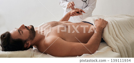 Chiropractor inserts acupuncture needle into man's hand. Acupuncture treatment, reflexology, alternative medicine Chiropractor inserts acupuncture needle into man's hand. Acupuncture treatment, reflexology, alternative medicine 139111934