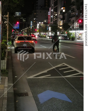 Image of a bicycle overtaking a parked car. Image of a bicycle overtaking a parked car. 139112441