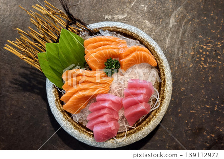 Fresh Tuna Salmon Sashimi on Bowl over table. Japenese food Fresh Tuna Salmon Sashimi on Bowl over table. Japenese food 139112972